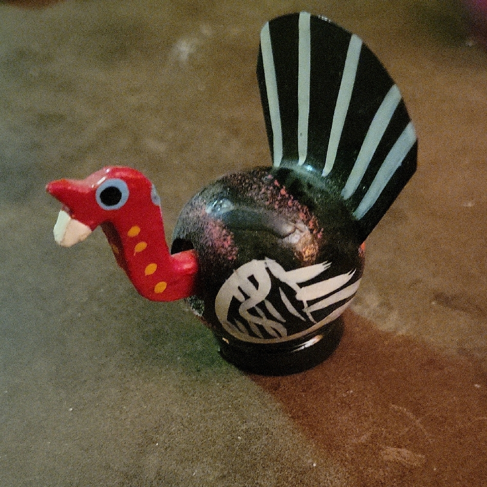 The item is a handcrafted Mexican folk art bobblehead, Colorful Bird Toy